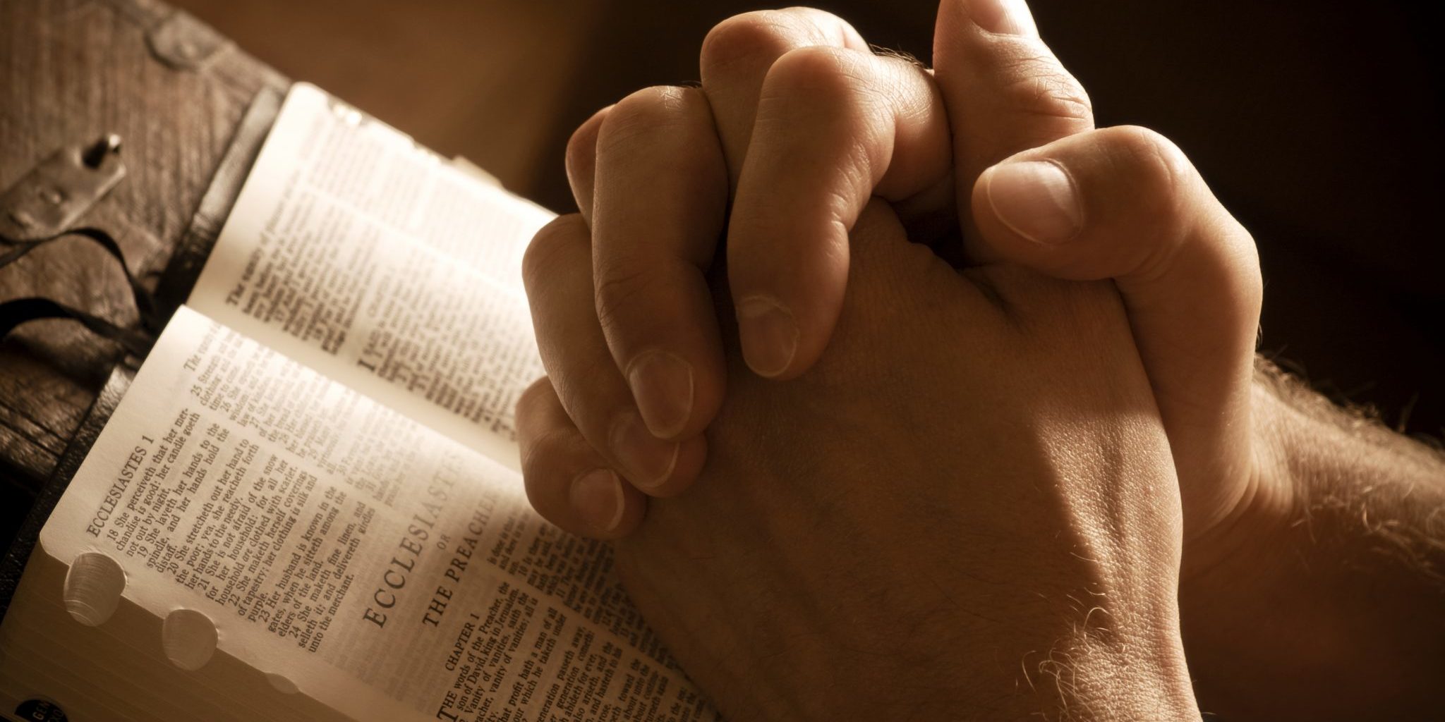 bigstock-Praying-Hands-On-An-Open-Bible-3407461